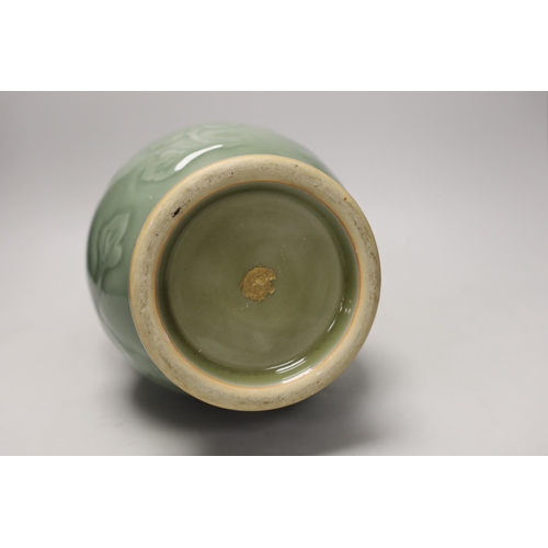 1301 - A two handled Chinese celadon glazed vase. 32cm tall