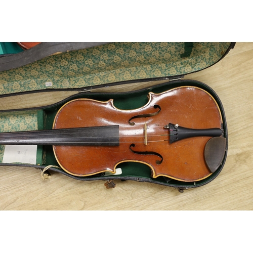 1308 - Two cased violins, one bow