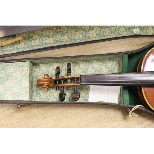 1308 - Two cased violins, one bow