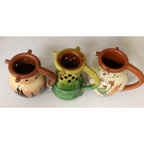 1315 - Three West Country mottoware puzzle jugs. Tallest 12cm