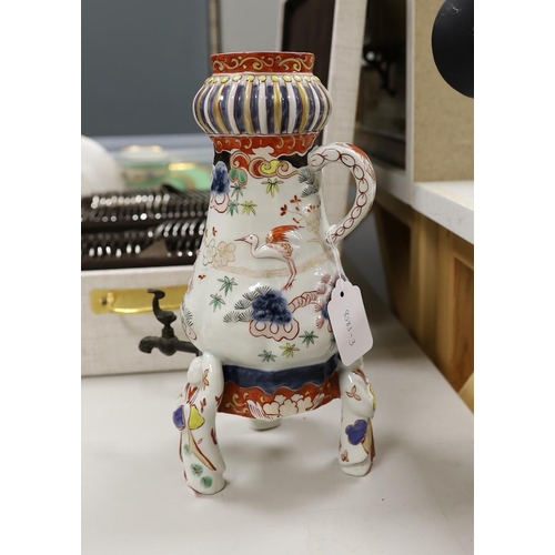 1316 - A Japanese Arita or Imari porcelain tripod urn, 29.5 cm high