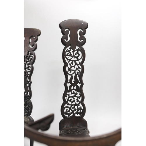 1318 - A pair of Chinese carved hongmu dish stands, late 19th century, 32cm tall