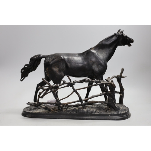 1328 - A Russian black painted cast iron horse model, makers mark to base. 42cm long