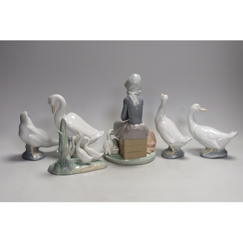 1330 - A Lladro seated girl with ducks and five Nao ducks