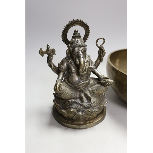 1331 - A plated figure of Ganesha and a Tibetan singing bowl with striker