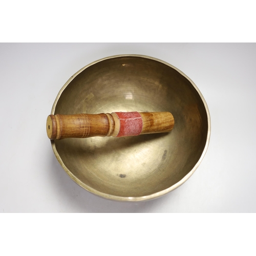 1331 - A plated figure of Ganesha and a Tibetan singing bowl with striker