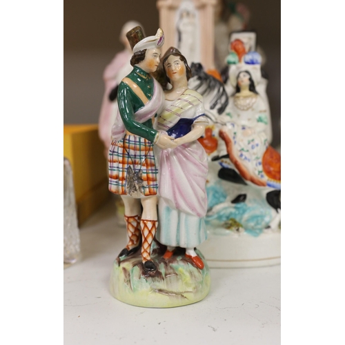 1335 - A collection of eight Victorian Staffordshire figures or groups, largest 36cm