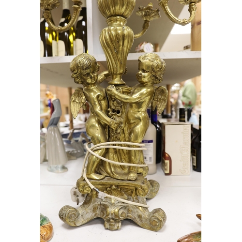 1352 - A pair of heavy brass candelabra, 85cm total height