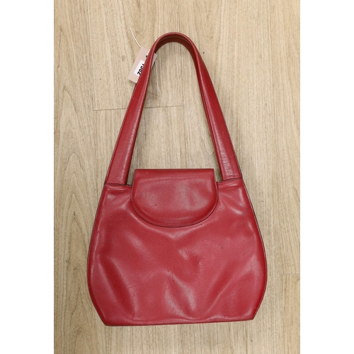 1382 - A red Cartier Panther bag, 54cms from the top of the handle to base of bag,