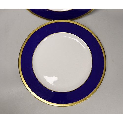 1388 - Six Asprey, London, blue and gilt banded dinner plates, 34cms diameter