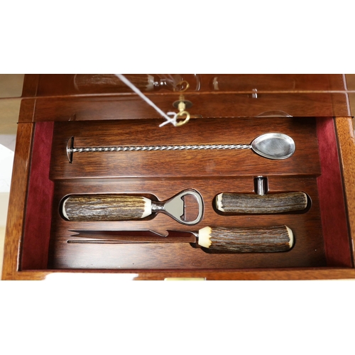 1396 - An inlaid travelling decanter box, with lower drawer and a set of  Royal Doulton glasses