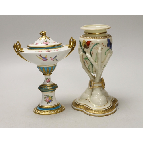 1408 - A Royal Worcester urn, modelled as three birds legs holding an oviform vase and a Royal Crown Derby ... 