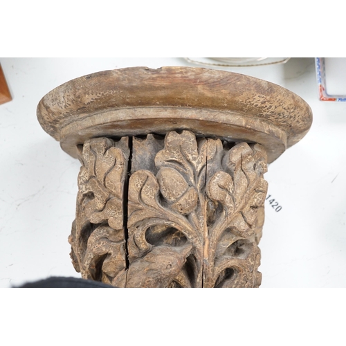 1420 - A Victorian/Edwardian carved pine wall bracket, carved with a bird within scrolling oak leaves, 36cm... 