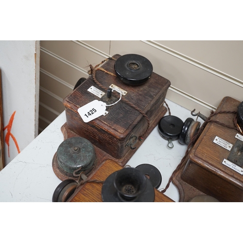 1425 - Three Ericsson oak cased railway signal box telephones, largest 30cms long