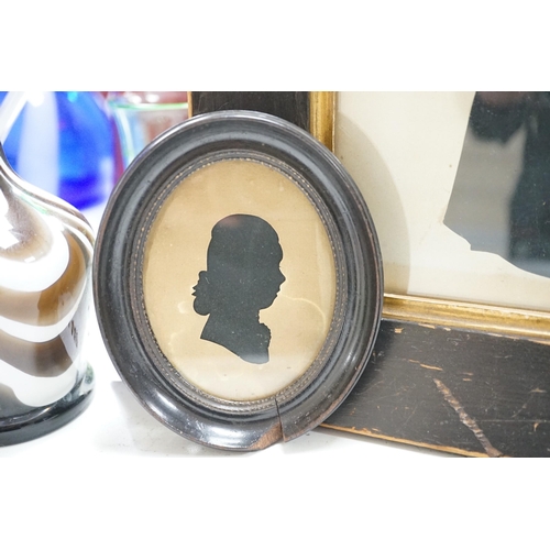 1440 - An oval silhouette dated on reverse 1777 together with a larger later silhouette-25cms high x 19cms ... 