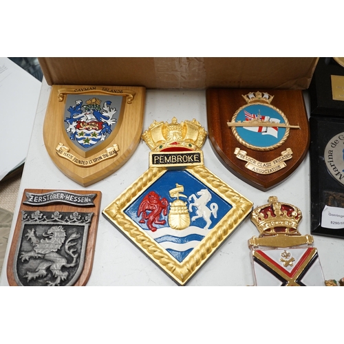 1444 - A collection of approximately twenty five plaster and other naval / military and Royal wall hanging ... 