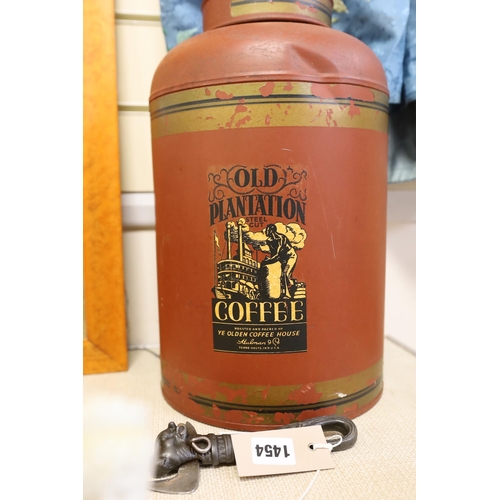 1454 - A large toleware tin coffee canister and a novelty iron can opener, canister 38cms high