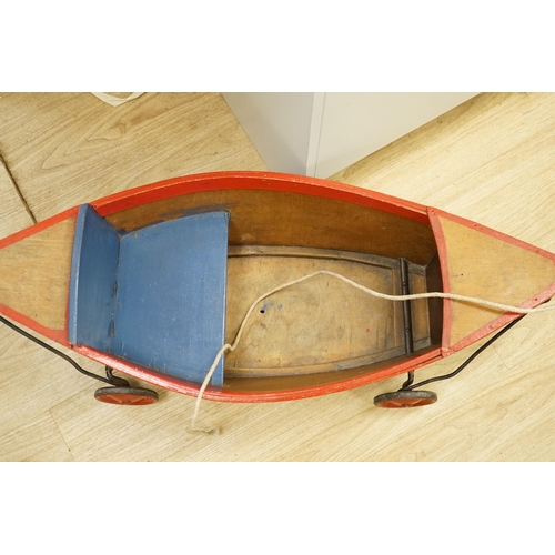 1459 - A 1930's Child's pull-along boat, on wheels, 96cms long