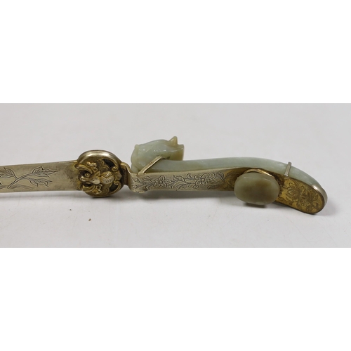 1504 - A Chinese celadon jade belt hook handled paperknife, the 19th century belt hook 8.2 cm long, total l... 