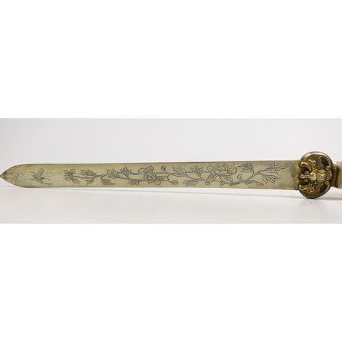 1504 - A Chinese celadon jade belt hook handled paperknife, the 19th century belt hook 8.2 cm long, total l... 