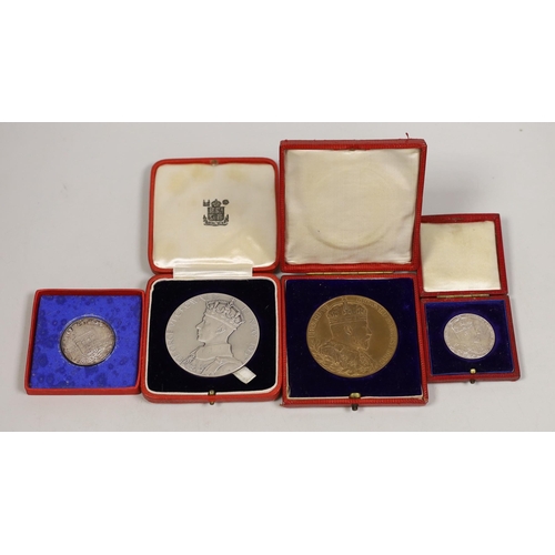 1514 - A cased George VI coronation silver medal, matt, smaller medal and an Edward VII coronation medal, b... 