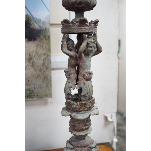 1533 - A pair French cast metal candlesticks. 47cm tall