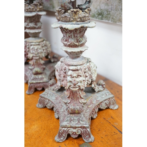 1533 - A pair French cast metal candlesticks. 47cm tall