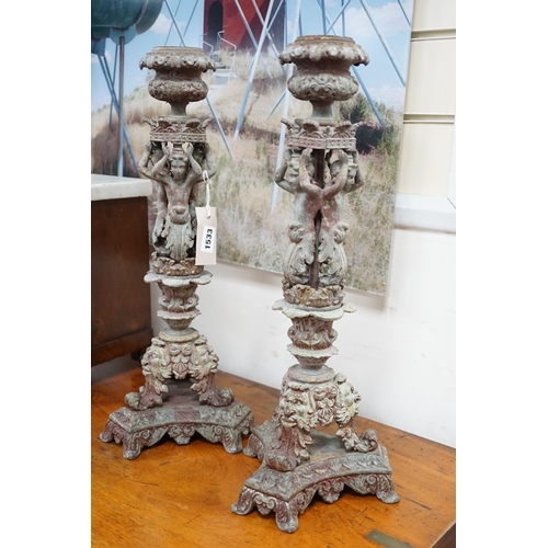 1533 - A pair French cast metal candlesticks. 47cm tall