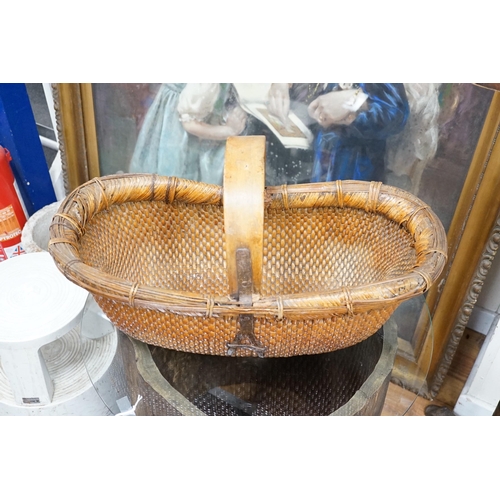 1535 - A brass mounted Chinese wicker trug basket. 67cm long