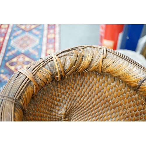 1535 - A brass mounted Chinese wicker trug basket. 67cm long