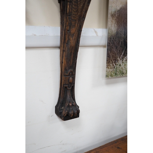 1536 - A carved figural wall mount. 64cm tall