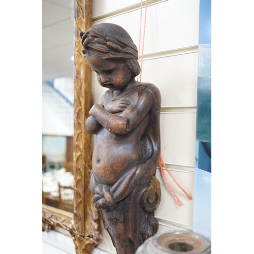 1536 - A carved figural wall mount. 64cm tall