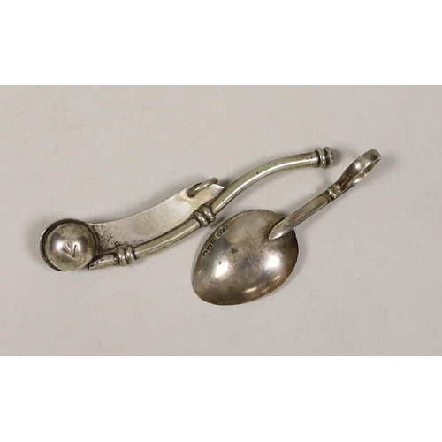 1830 - A George V silver caddy spoon and a plated bosuns whistle.