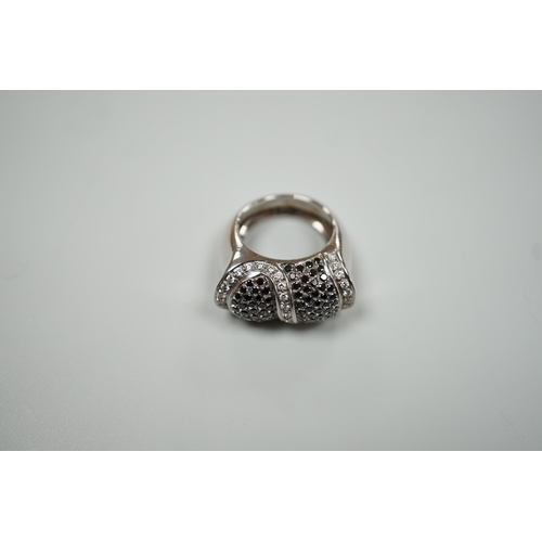 1877 - A modern 750 white metal and pave set two colour diamond dress ring, size K/L, gross weight 15.4 gra... 