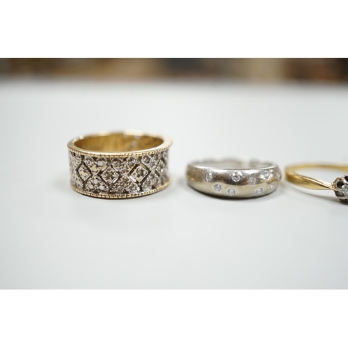 1879 - Three modern 9ct gold and diamond chip set rings and a yellow metal and solitaire diamond set ring, ... 