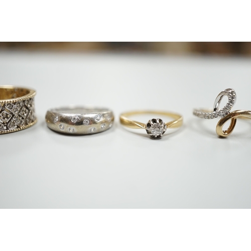 1879 - Three modern 9ct gold and diamond chip set rings and a yellow metal and solitaire diamond set ring, ... 