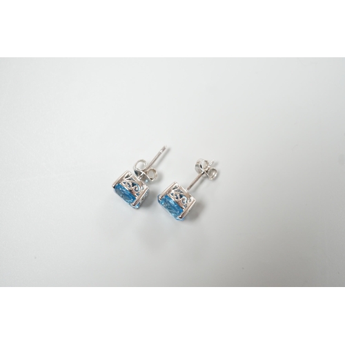 1880 - A modern pair of white metal (stamped 18) and single stone blue topaz set ear studs, 7mm, gross weig... 