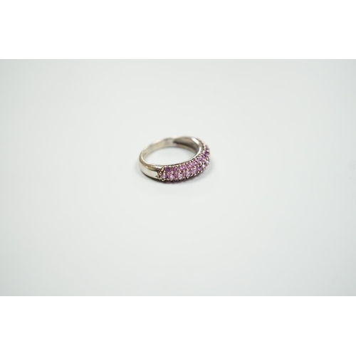 1886 - A modern 18ct white gold and pink stone cluster set half hoop ring, size J, gross weight 4.2 grams.... 