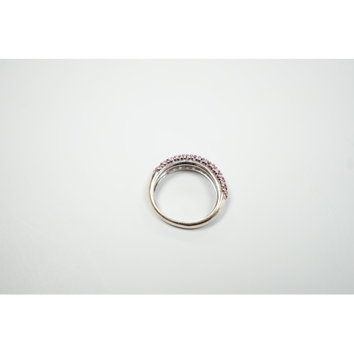 1886 - A modern 18ct white gold and pink stone cluster set half hoop ring, size J, gross weight 4.2 grams.... 