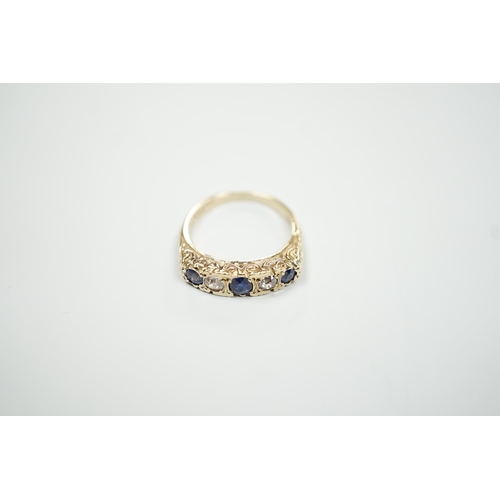 1889 - A modern Victorian style 9ct gold, three stone sapphire and two stone diamond set half hoop ring, si... 