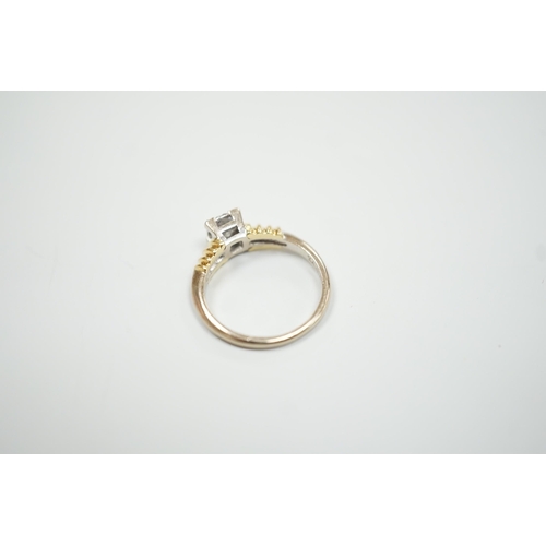 1890 - A modern 18ct two colour gold and solitaire diamond set ring, size H/I, gross weight 3.3 grams.... 