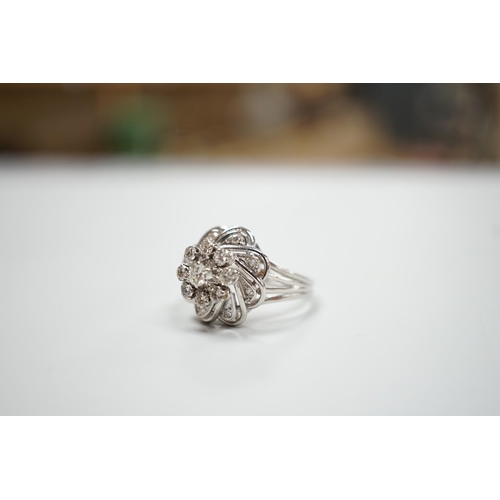 1893 - A French white metal (18ct poincon mark) and diamond cluster set dress ring, size L/M, gross weight4... 