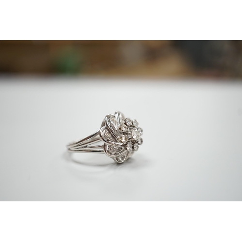 1893 - A French white metal (18ct poincon mark) and diamond cluster set dress ring, size L/M, gross weight4... 