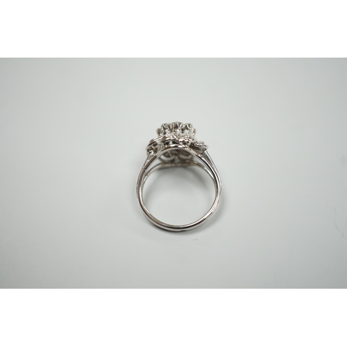 1893 - A French white metal (18ct poincon mark) and diamond cluster set dress ring, size L/M, gross weight4... 