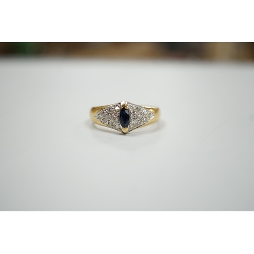 1895 - A modern 18ct gold and single stone marquise cut sapphire set dress ring, with pave set diamond shou... 