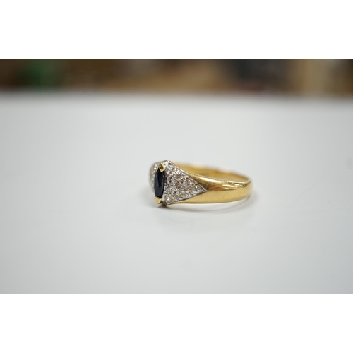 1895 - A modern 18ct gold and single stone marquise cut sapphire set dress ring, with pave set diamond shou... 