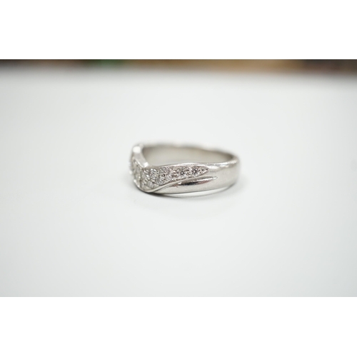 1897 - A modern platinum and diamond cluster set 'chevron' ring, size N, gross weight 9.2 grams.