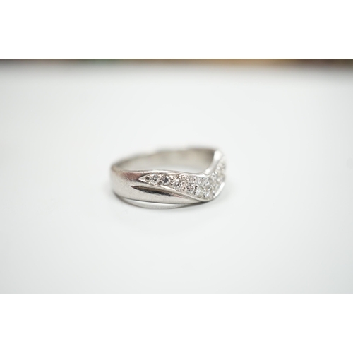 1897 - A modern platinum and diamond cluster set 'chevron' ring, size N, gross weight 9.2 grams.