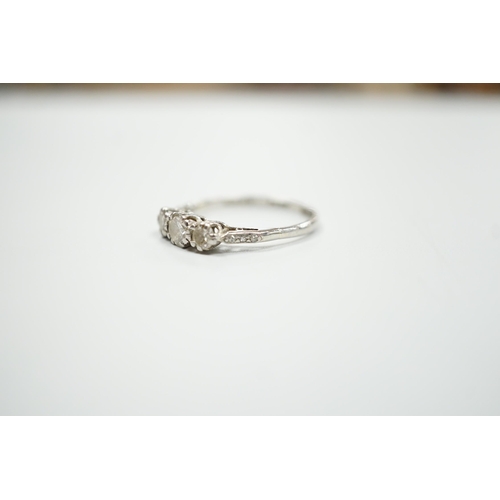 1900 - A white metal, stamped plat and three stone diamond set ring, size M/N, gross weight 2.8 grams, with... 