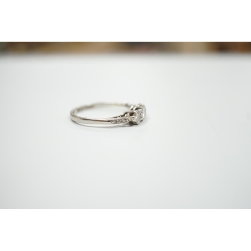 1900 - A white metal, stamped plat and three stone diamond set ring, size M/N, gross weight 2.8 grams, with... 